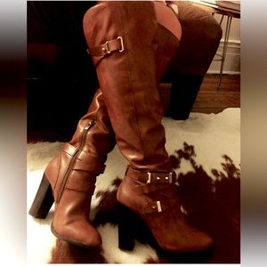 Brown knee high boots with buckle detail. Size 7